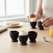 Set Of Four Black Text Egg Cups