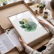 Wall Art Greenery Botanical Watercolour Leaves White Green Ochre displayed on a wall in a styled room