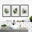 Wall Art Greenery Botanical Watercolour Leaves White Green Ochre displayed on a wall in a styled room — view 3