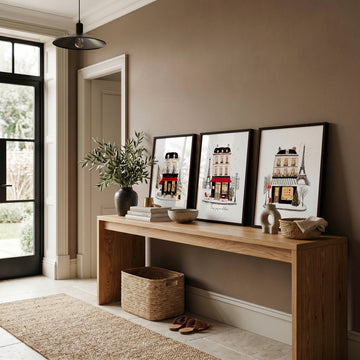 Paris Travel Wall Art Pieces | "Paris sous un ciel d'hiver" Illustrated Street Scenes displayed on a wall in a styled room