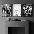 Wildlife Art wall art Black & White Safari — Elephants, Birds & Zebra displayed on a wall in a styled room